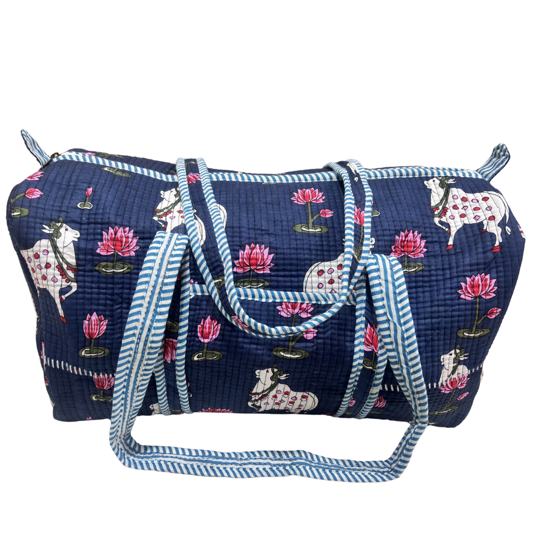 Side view of Pushkar Balloon quilted duffle (Blue variant) showing zipper closure and reinforced base