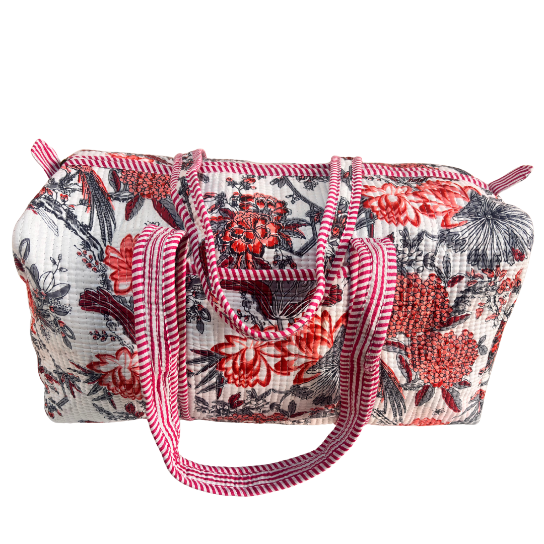Side view of Pushkar Balloon quilted duffle (Floral White) showing zipper closure and reinforced base