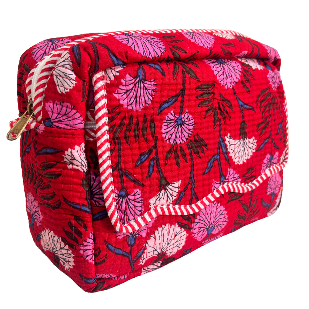 Quilted cotton travel makeup pouch by RajPadmini — angled view highlighting hand-block-printed design