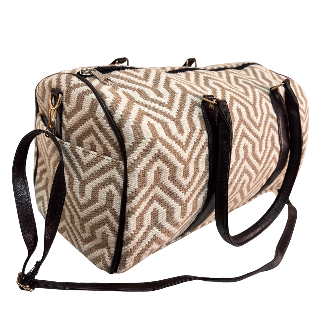 Close-up of ivory and beige jacquard weave fabric on RajPadmini travel duffle