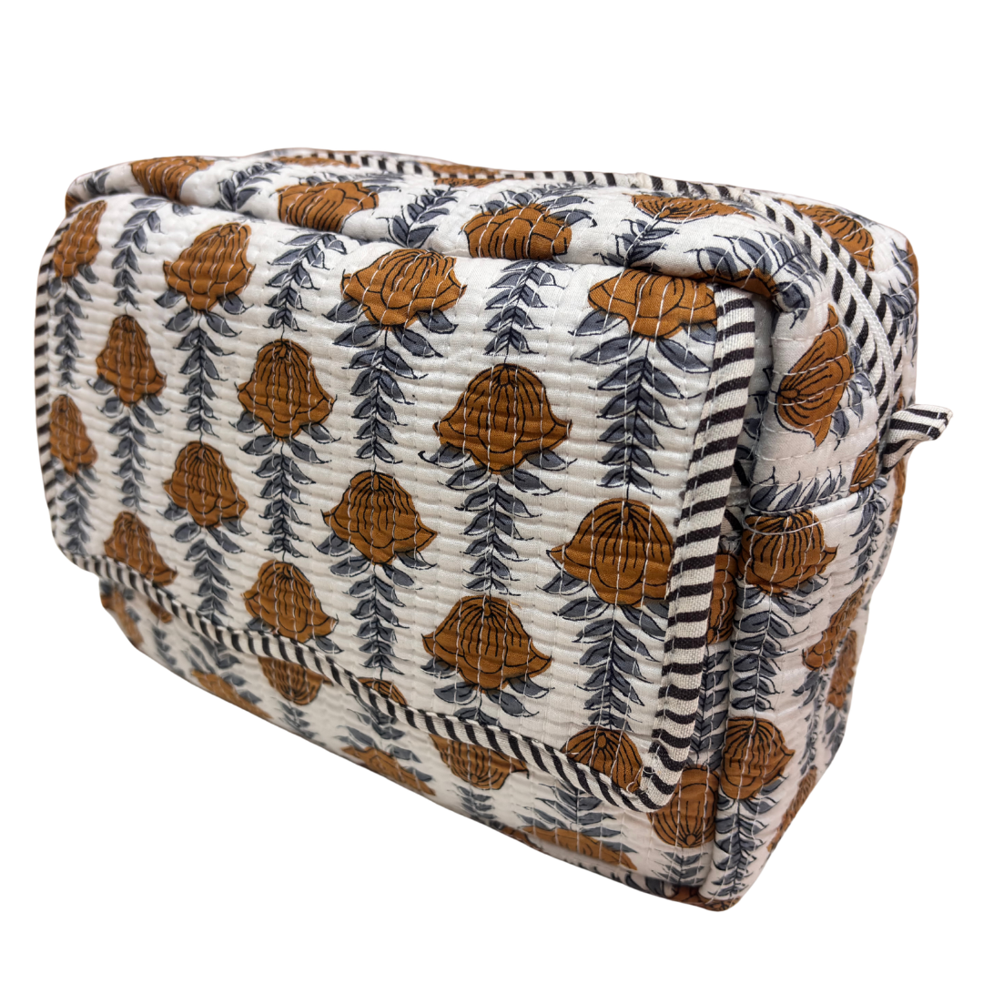Quilted cotton travel makeup pouch by RajPadmini — angled view highlighting hand-block-printed design
