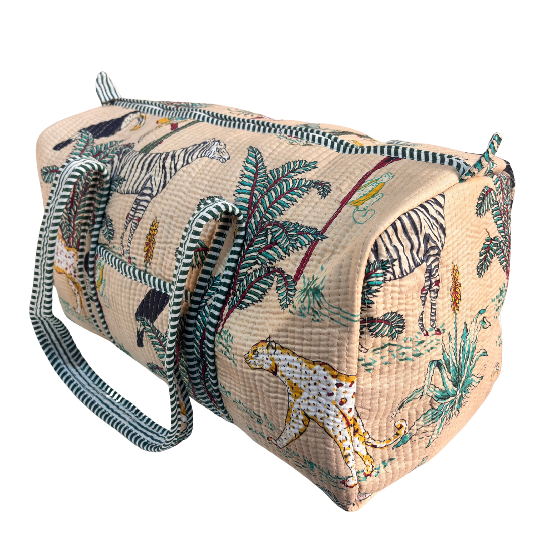 Close-up of quilted cotton fabric on Pushkar Balloon Animal Print Off-White duffle by RajPadmini