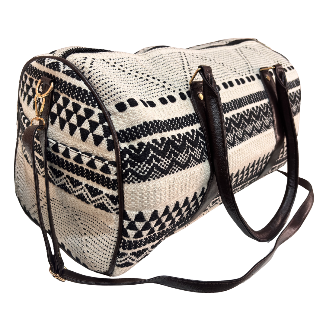 Close-up of black and white jacquard weave fabric on RajPadmini travel duffle