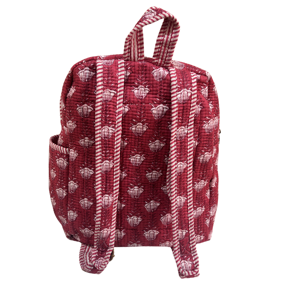 Pink quilted backpack interior — main compartment with laptop section