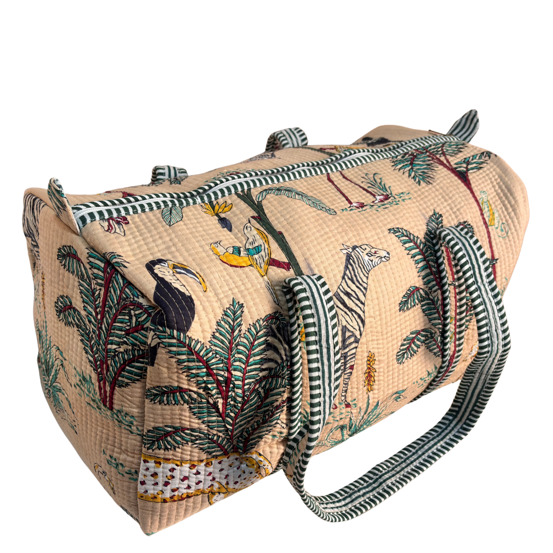 Top handles and zipper detail on Pushkar Balloon quilted duffle (Animal Print Off-White)