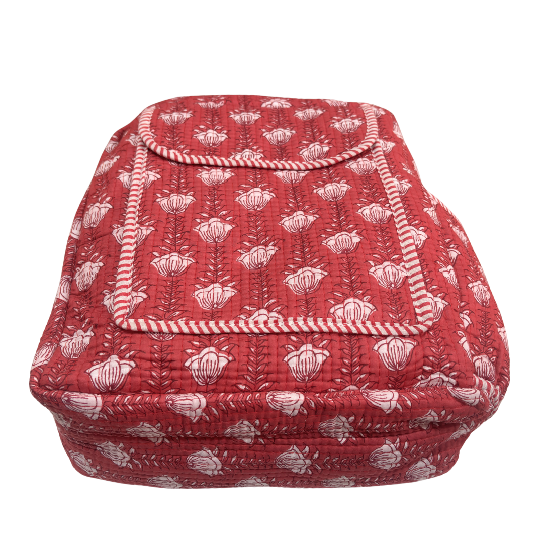 Pink quilted backpack zipper detail — durable cotton closure