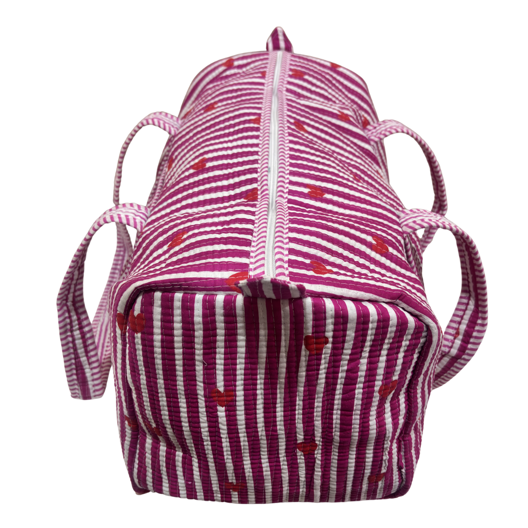 Top handles and zipper detail on Pushkar Balloon quilted duffle (Pink variant)