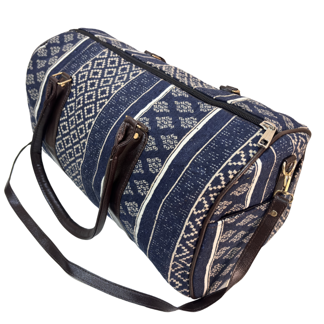 Top handles and zipper closure on Jodhpur Blue cotton travel duffle