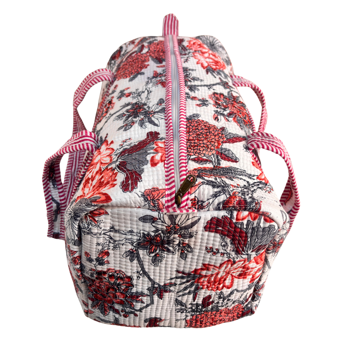 Top handles and zipper detail on Pushkar Balloon quilted duffle (Floral White)