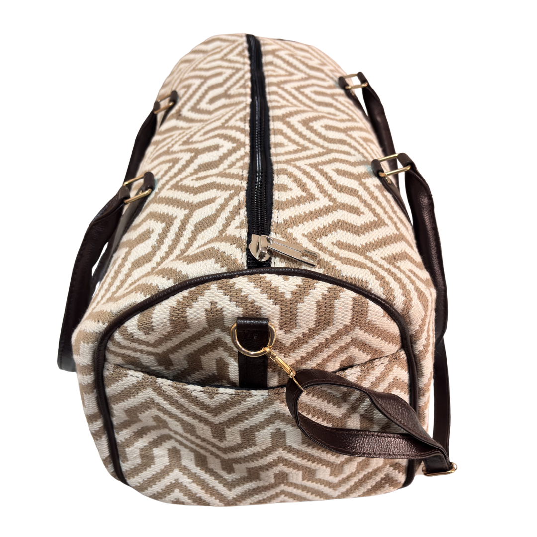 Top handles and zipper closure on Sandstone Ivory jacquard duffle bag