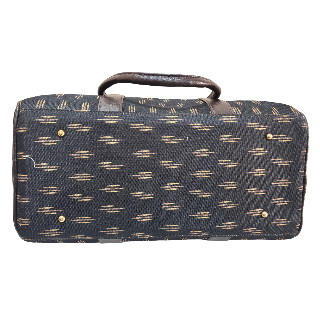 Riveted base of black cabin-size travel duffle — reinforced bottom for airport and gym use