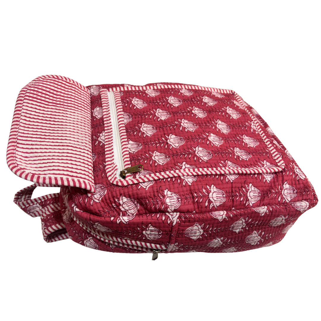 Pink quilted cotton fabric close-up — floral diamond stitching