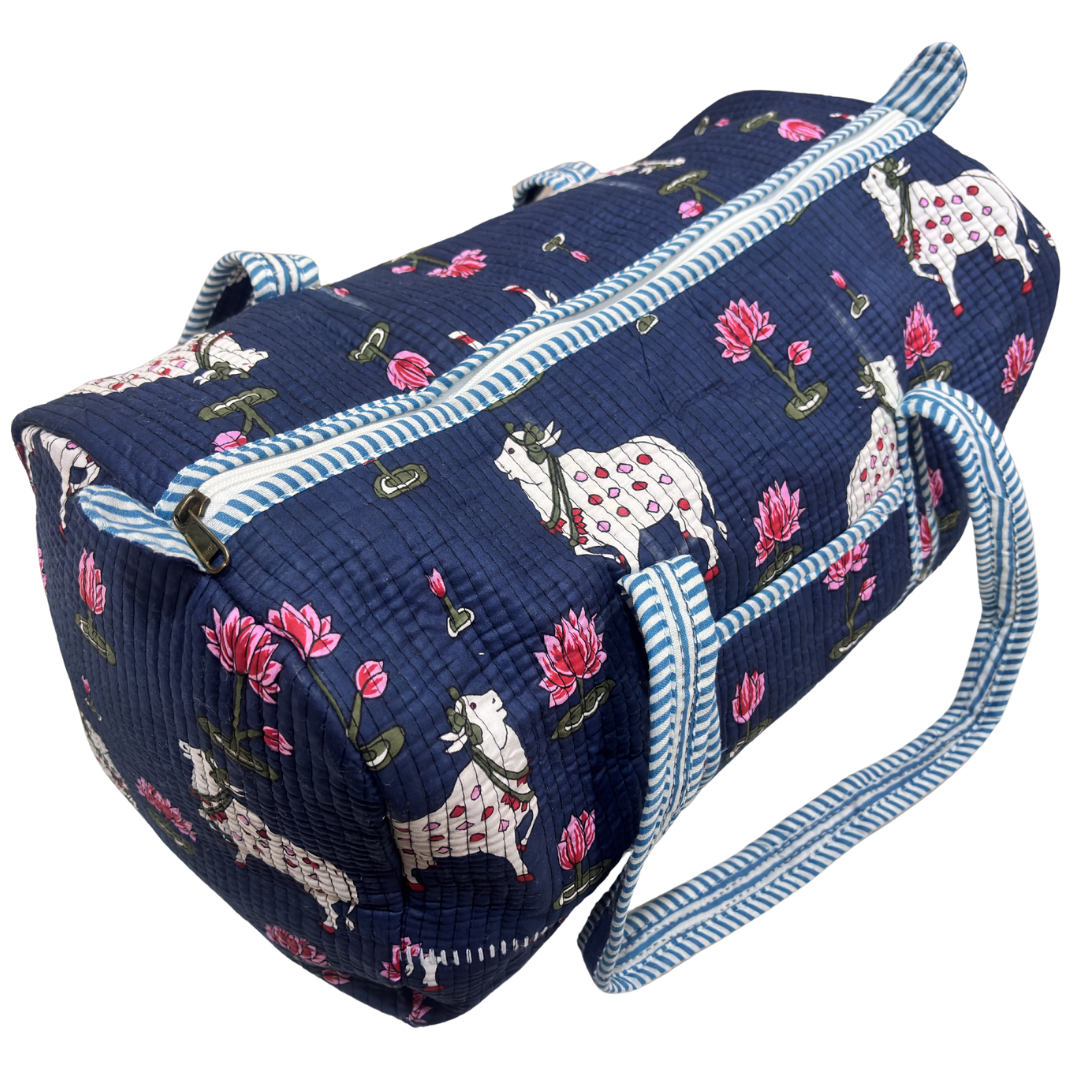 Reinforced base of Pushkar Balloon Blue quilted duffle — cabin-friendly travel duffle bag