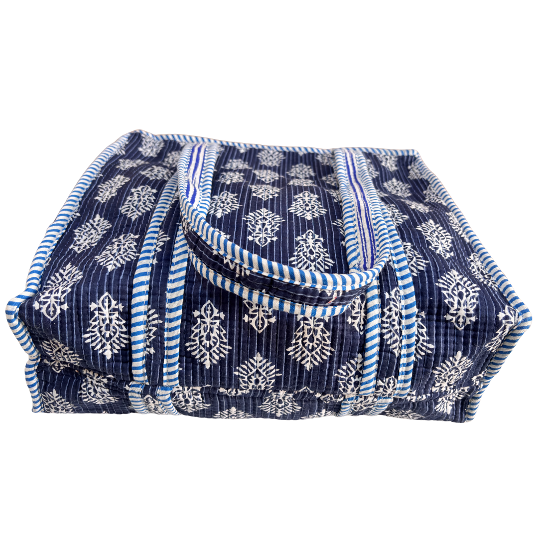 Blue quilted fabric close-up — handcrafted diamond stitching from Jaipur