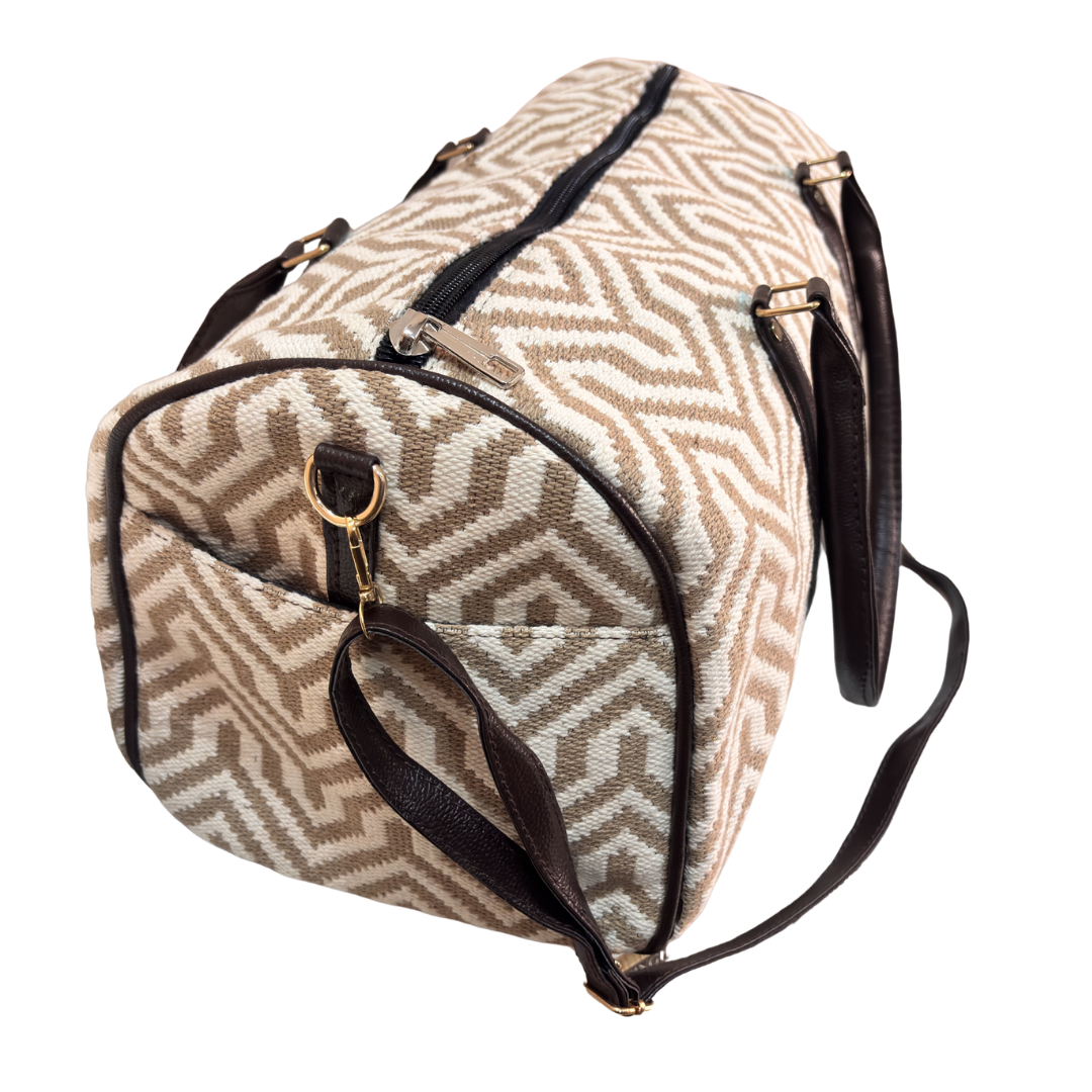Riveted base of ivory and beige cabin-size travel duffle bag