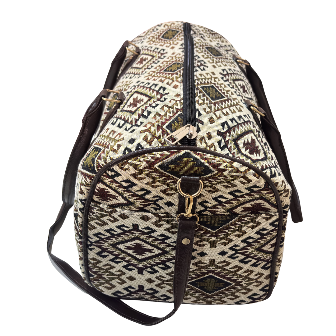 Riveted base of cream and brown cabin-size cotton travel duffle bag