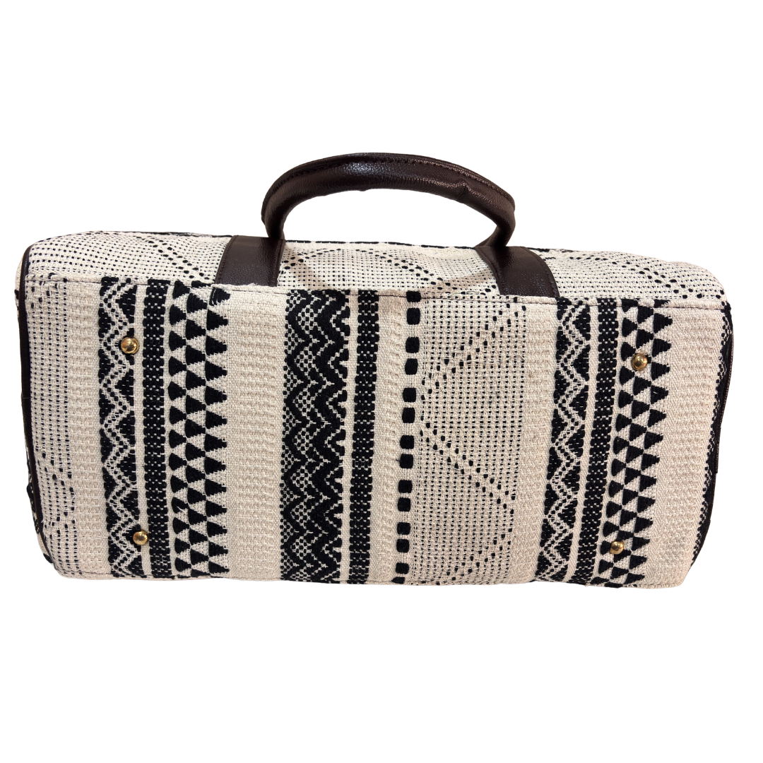 Monochrome white and black jacquard duffle bag styled for business travel and gym