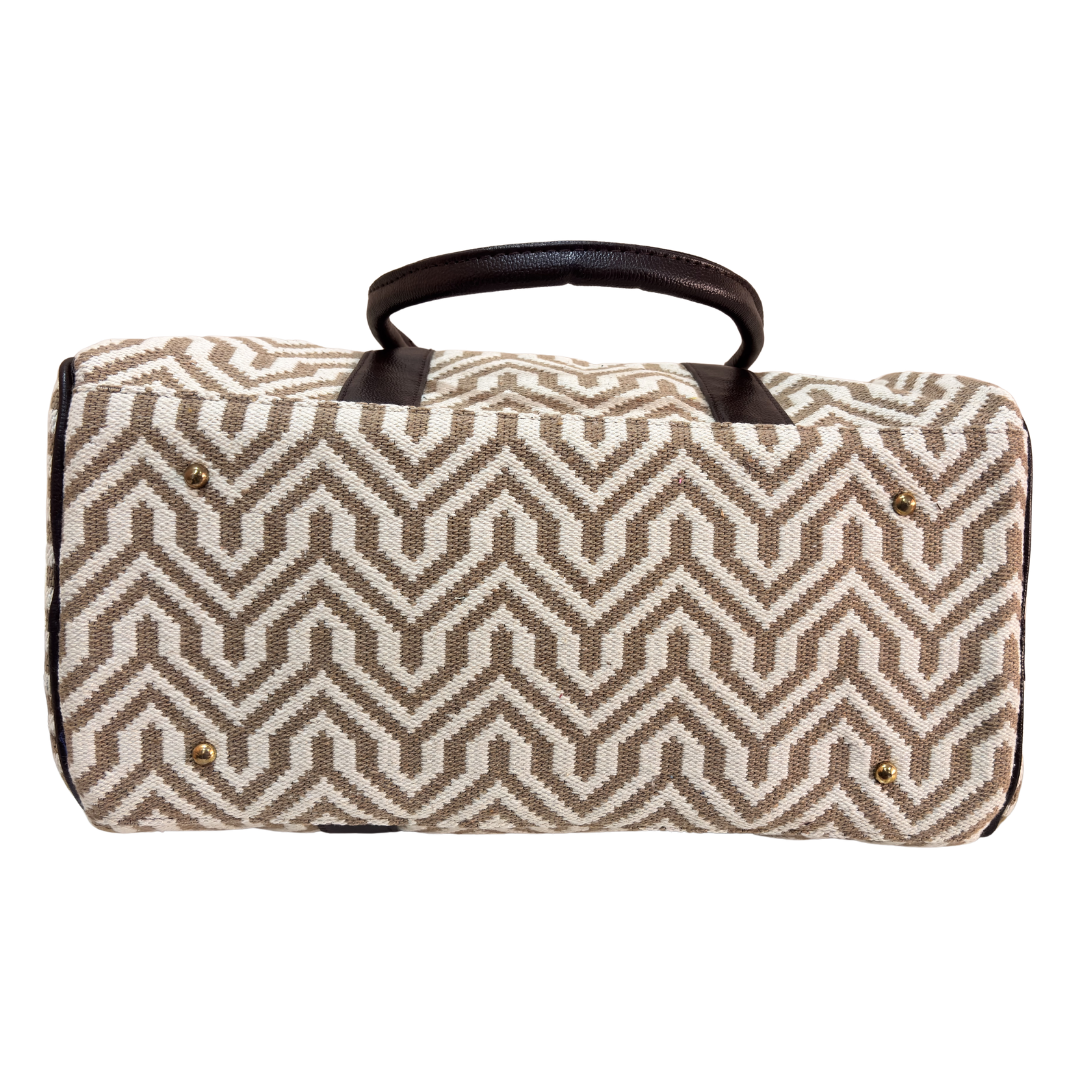 White and beige jacquard duffle bag styled for weekend travel and wedding-season carry